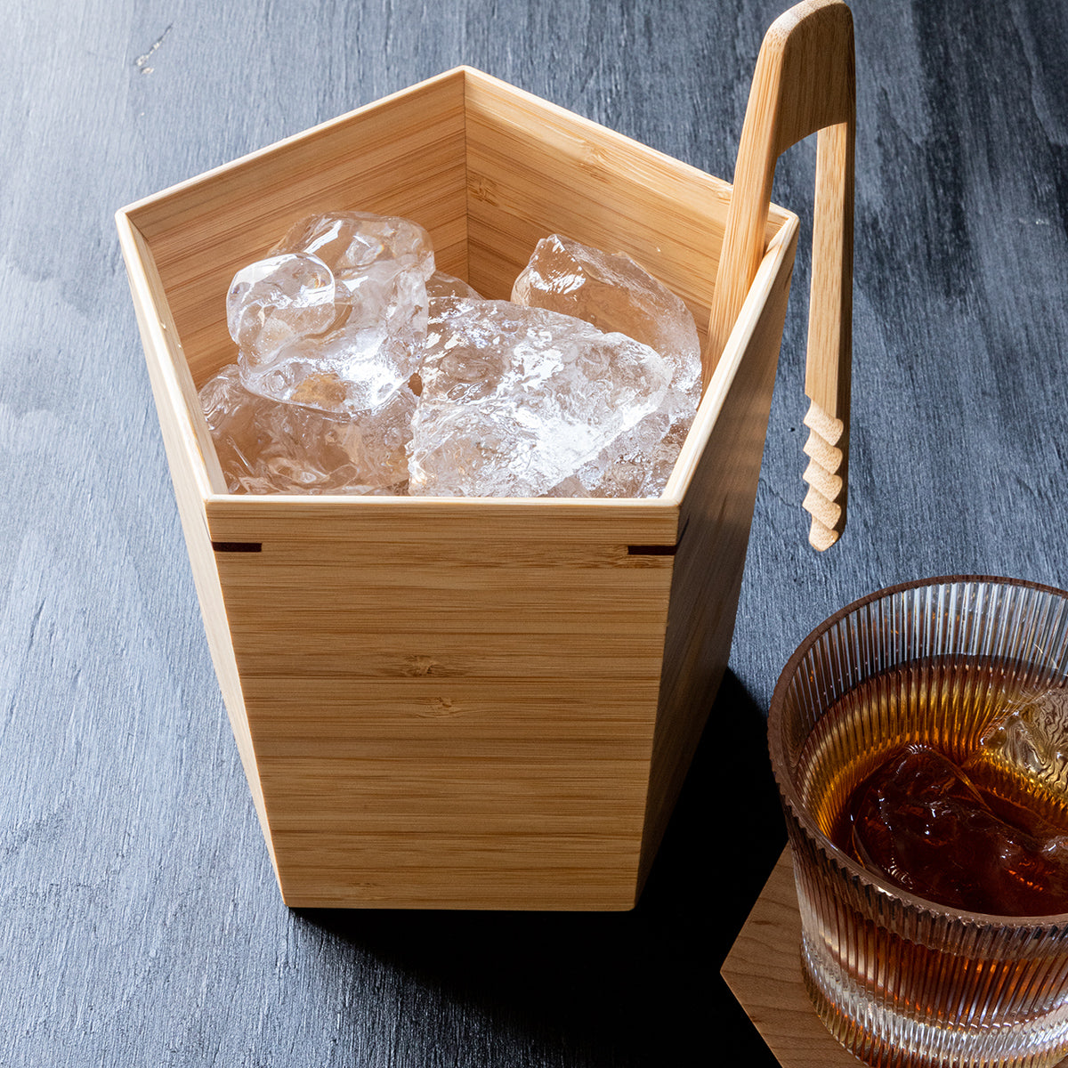 A pentagonal ice bucket with a bamboo texture